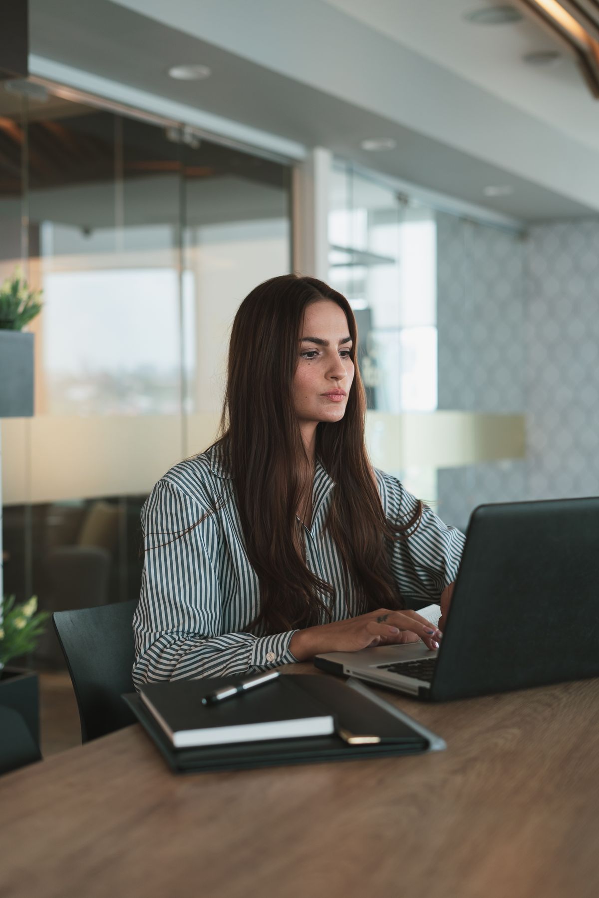 A business owner reviewing her website audit at her desk